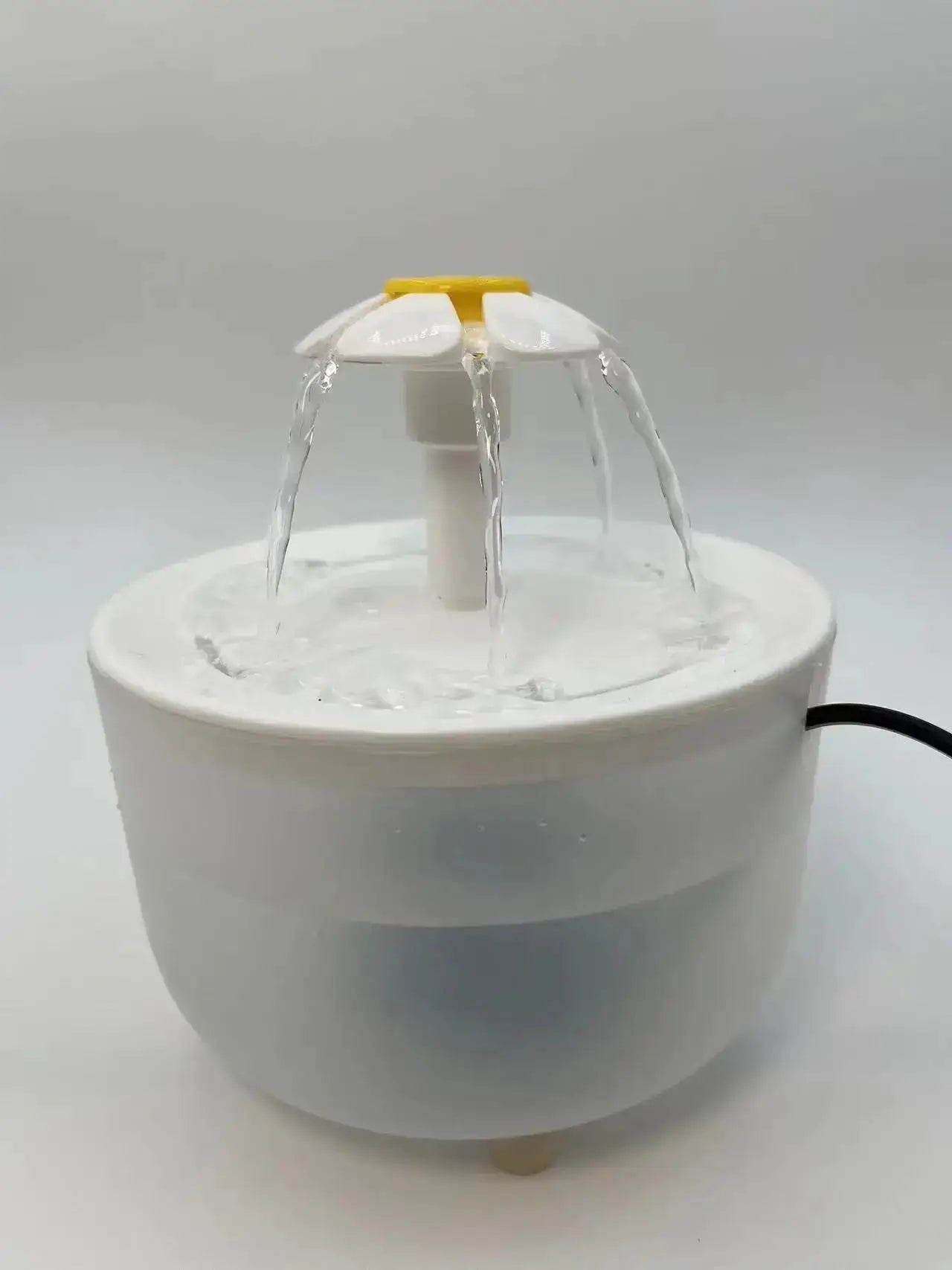 Cat Water Fountain with flowing water, designed for fresh and filtered hydration for pets.