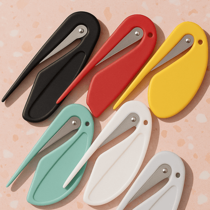 Colorful Pet Hair Knot Cutter & Detangler Tool in black, red, yellow, mint, white, and teal on a pastel background.